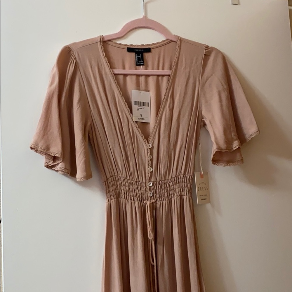 Nude colored long dress.